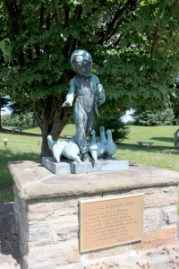 Innocents Garden feature of child feeding ducks.