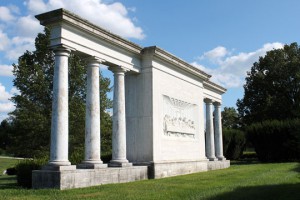 Last Supper garden feature flanked by marble pillars.