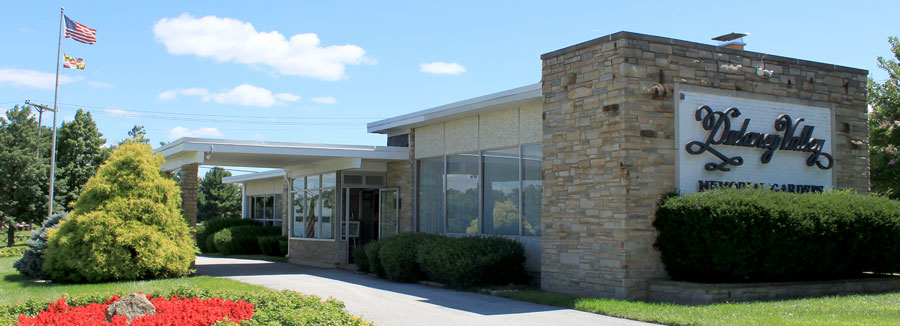 Dulaney Valley Memorial Gardens office building with carport and landscaping.