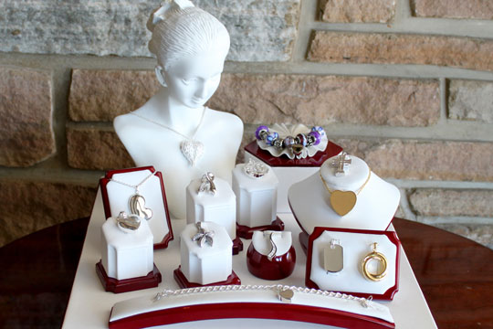 Cremation Jewelry for ashes including necklaces with pendants, bracelets, and rings.