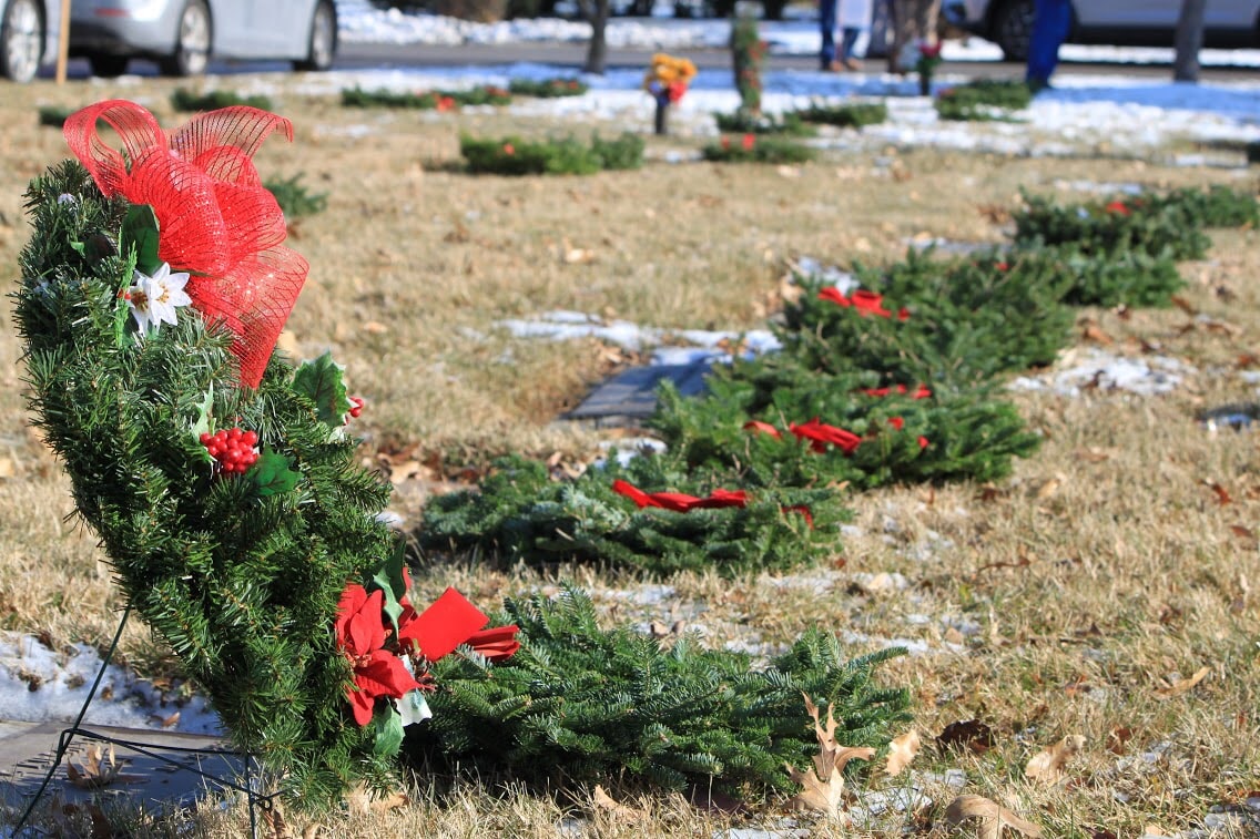 Wreaths Across America wreaths laying on veterans graves.