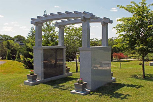 Harmony Hill garden cremation trellis feature facing lake.